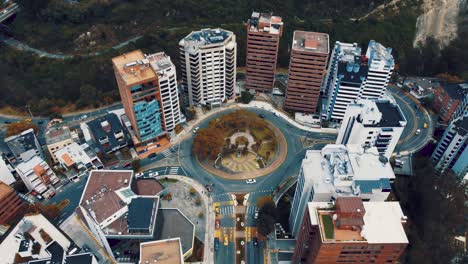 View-of-a-roundabout-in-the-capital-of-Ecuador,-South-America-with-heavy-traffic