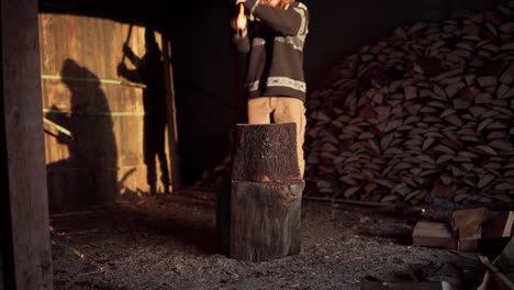Man-With-An-Ax-Chopping-Wood---Wide-Shot