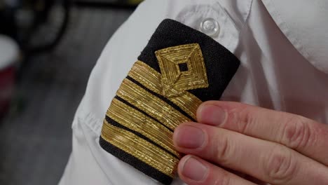 Captain-four-striped-shoulder-epaulettes,-close-up