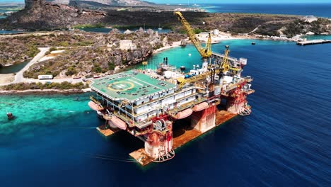 The-drone-is-flying-around-an-oil-platform-at-the-Caracas-Bay-Curacao-Aerial-Footage-4K