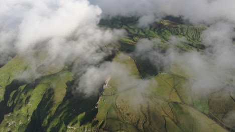 Flying-above-low-clouds-at-flores-island-Azores---drone-shot