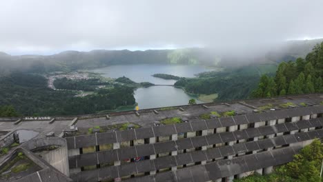 Fly-over-a-famous-abandoned-hotel-Monte-palace-at-São-Miguel-Azores,-aerial