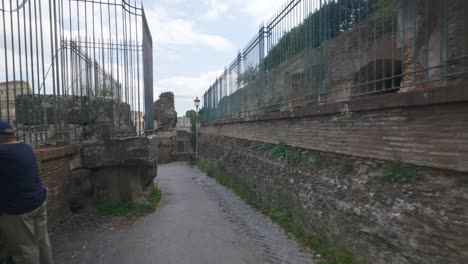 Rome-Immersive-POV:-Moving-In-Busy-Streets-to-Chiesa-Santi-Luca-e-Martina,-Italy,-Europe,-Walking,-Shaky,-4K-|-Speed-Walking-Near-People-In-Ruins