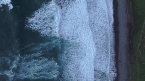 Top-down-view-of-atlantic-ocean-with-big-waves-in-Azores,-aerial