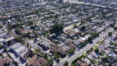 Aerial-View-of-Mid-City-Neighborhood,-Los-Angeles,-California-USA,-Houses-and-Streets-on-Sunny-Day