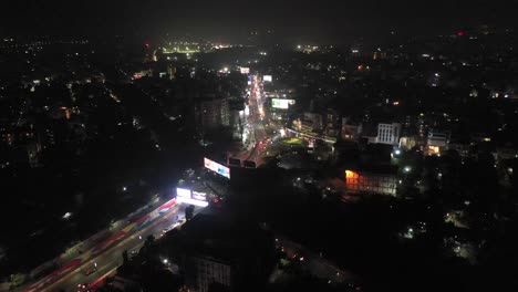 Rajkot-Aerial-Drone-View-Lots-of-vehicles-coming-out-of-the-under-bridge-and-moving-forward
