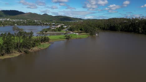 Oxenford,-Gold-Coast,-4-January-2024---Aerial-views-of-the-Coomera-River-approaching-the-Causeway-with-receding-flood-waters-from-the-January-storms