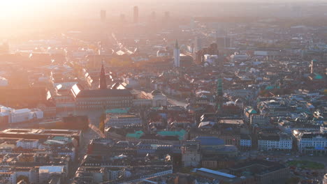 Tight-aerial-shot-over-central-Copenhagen-at-sunset