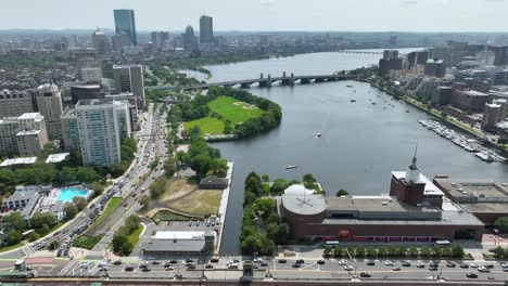 Drone-shot-of-Boston's-Museum-of-Science-and-Lederman-Park-both-sitting-on-the-Charles-River
