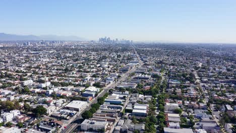 Drone-Shot-of-Los-Angeles-CA-USA,-Flying-Above-Mid-City-Neighborhood-on-Hot-Sunny-Day