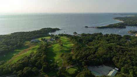 Orbiting-aerial-of-a-Cape-Cod-golf-course-looking-out-over-the-water