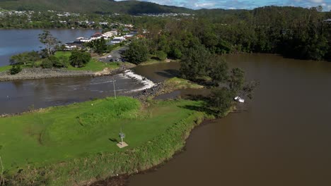 Oxenford,-Gold-Coast,-4-January-2024---Aerial-views-of-the-Coomera-River,-residential-housing-and-Causeway-with-receding-flood-waters-from-the-January-storms