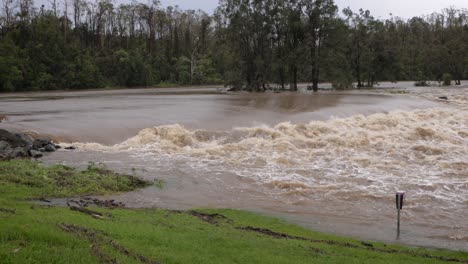 Coomera,-Gold-Coast,-2-January-2024---Coomera-River-Causeway-under-flood-waters-from-the-2024-Storms-in-January