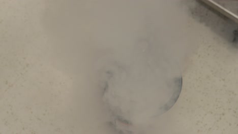 Formation-of-Vapor-During-the-Transfer-of-Liquid-Nitrogen-from-a-Storage-Tank-to-a-Dewar---Close-Up