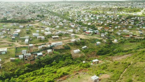 Drone-aerial-of-a-huge-informal-settlement-at-a-coastal-town-in-South-Africa