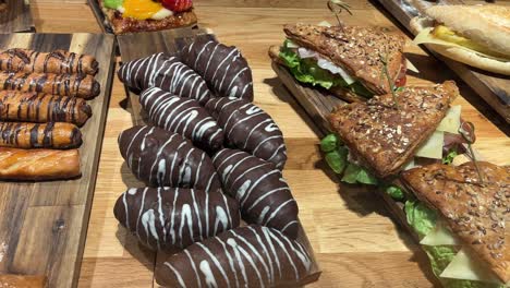 Assorted-chocolate-drizzled-pastries-and-multi-grain-sandwiches