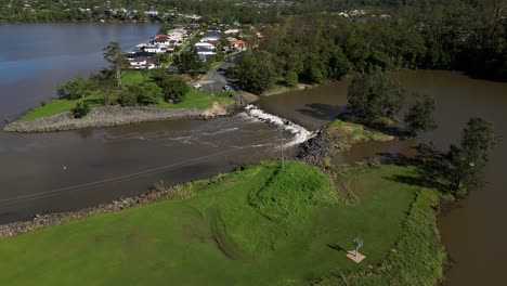 Oxenford,-Gold-Coast,-4-January-2024---Circular-aerial-views-of-the-Coomera-River-and-Causeway-with-receding-flood-waters-from-the-January-storms