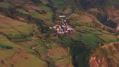 Aerial-tilt-up-shot-of-Mosteiro-village-at-Flores-Azores---drone-shot