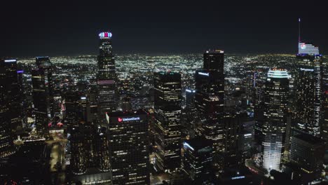 Downtown-Los-Angeles-at-Night,-Aerial-View-of-Shiny-Lights-on-Skyscrapers-and-Streets