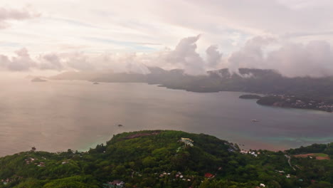 Aerial-drone-shot-of-picturesque-sunset-cloudscape-on-Mahè-island,-Seychelles