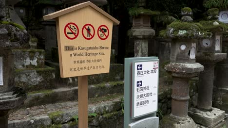 Wooden-Sign-Post-At-Kasuga-Taisha-Shrine-Showing-Prohibited-Items