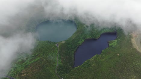 Low-clouds-at-Miradouro-Lagoa-Negra-e-Lagoa-Comprida-at-Flores-azores,-aerial