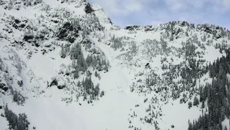 Aerial-timelapse-of-skiers-working-their-way-up-the-steep-Snoqualmie-Pass