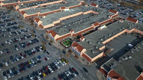 Aerial-top-down-shot-of-parking-cars-at-shopping-mall-during-christmas-time