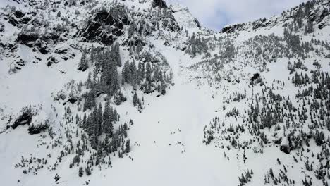 Slow-establishing-shot-of-backcountry-skiers-climbing-the-Snoqualmie-Pass