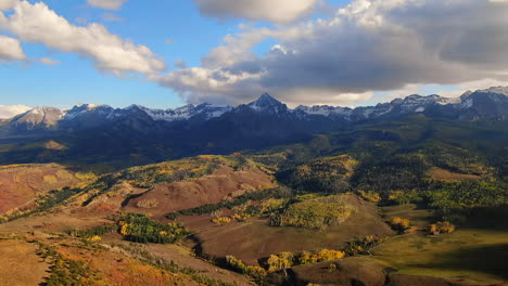 Colorful-Colorado-Million-Dollar-Highway-Mount-Sniffels-Wilderness-Dallas-Range-aerial-cinematic-drone-sunny-morning-autumn-fall-colors-San-Juans-Ridgway-Ralph-Lauren-Ranch-14er-forward-slowly-motion