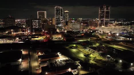 Fort-Worth,-Texas-skyline-at-night-with-drone-video-moving-up