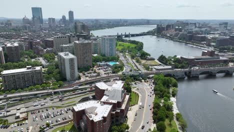 Drone-shot-of-the-Charles-River-cutting-through-Boston's-urban-areas