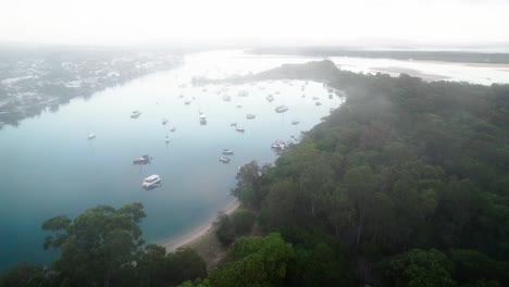 Aerial-View-Of-Boats-In-The-Water-On-A-Misty-Morning-In-Noosa-Heads,-QLD,-Australia