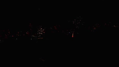 180º-drone-shot-of-2-fireworks-at-Fonte-da-Telha-beach-bars-in-Portugal