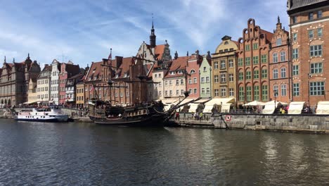 Gdansk,-Poland-with-Stara-Motlawa-river-with-historical-vessels-offering-tours-for-tourists-in-sunny-summer-day