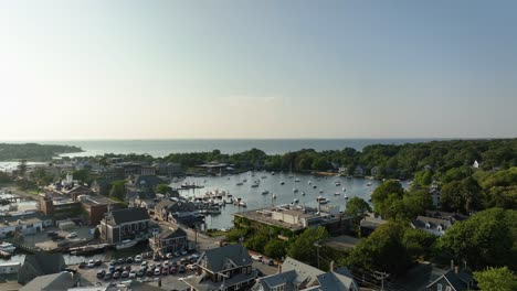 Rising-drone-shot-of-Cape-Cod's-protected-"Eel-Pond"-harbor-filled-with-boats