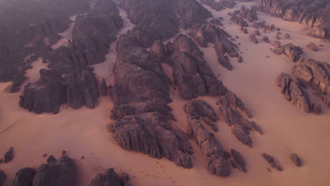 Sandstone-Rock-Formations-And-Dunes-At-Sunrise-In-Tassili-N’Ajjer-National-Park