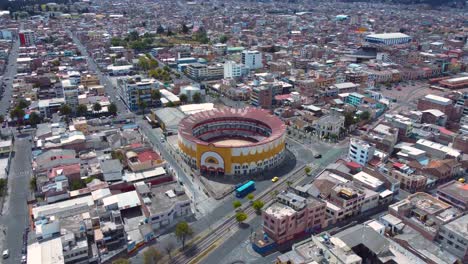 Cityscape-with-ancient-bullfighting-arena-in-Ecuador_drone-shot