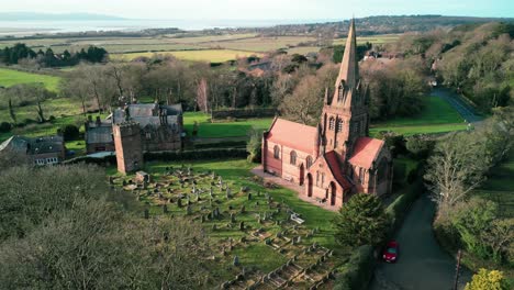 St-Bartholomew-Church,-Thurstaston,-Wirral---a-quintessential-Anglican-English-Parish-Church---Aerial-drone-clockwise-rotate-on-a-sunny-morning