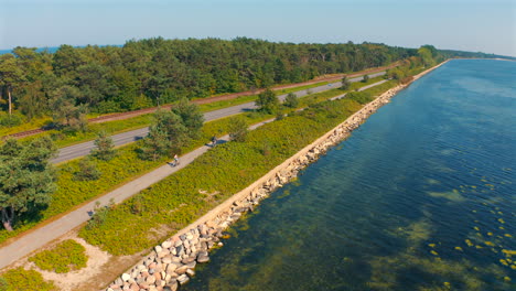 Cycling-on-the-biking-lane-near-the-baltic-sea-towards-Chalupy,-Poland