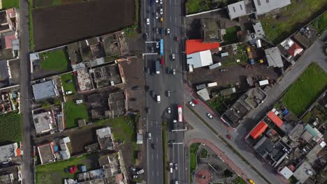Busy-city-intersection-Machachi-Ecuador-highway-E-35-drone-top-down-shot