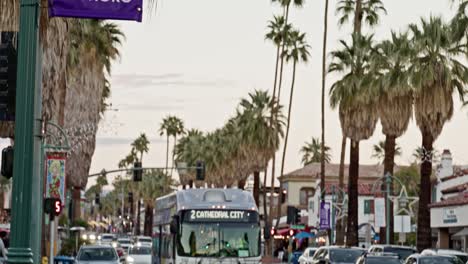 Palm-Springs-International-Film-Festival-banner-on-the-street-in-downtown-Palm-Springs,-California-with-camera-tilting-down-to-street
