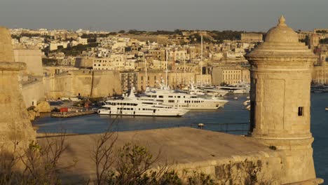 Yachts-Moored-In-The-Grand-Harbour,-Birgu,-Shot-From-The-Walls-Of-Upper-Barracca-Gardens,-Valletta