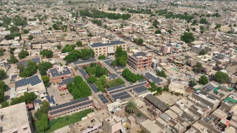 Drone-shot-of-Government-Taluka-Hospital-at-a-crowded-city-during-daytime-in-Shahdadpur,Sindh-in-Pakistan