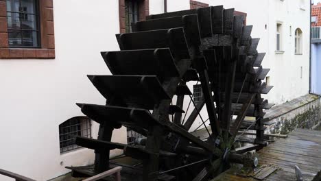 Huge-wooden-wheel-of-Grand-Priory-Mill-Prague,-Czech-Republic