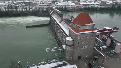 Traditional-Laufenburg-hydro-power-plant-during-high-water-at-the-Rhine-in-Switzerland