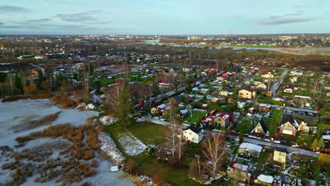 Beautiful-rural-village-in-early-winter-on-sunny-day,-aerial-drone-view