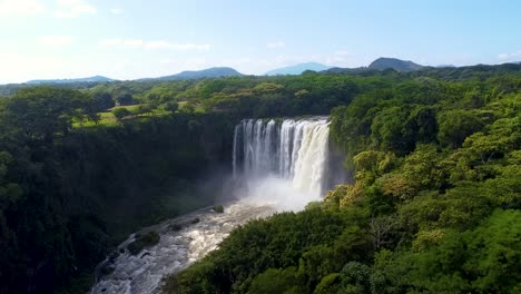 Aerial-panorama-view-of-beautiful-Eyipantla-Waterfall-in-Rainforest-area-pof-Mexico-during-Sunny-day---Forward-flight