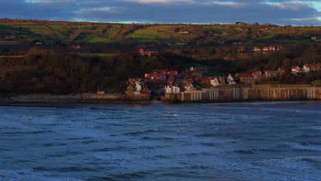 Wide-Angle-Drone-Shot-of-Robin-Hood's-Bay-at-Sunrise-North-Yorkshire-UK