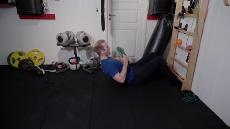Weighted-Rib-Wall-Sit-Ups,-Intense-Ab-Training-for-man-in-home-gym